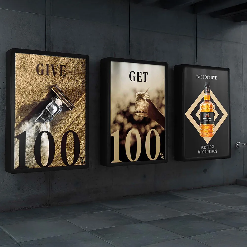 Street billboards featuring “GET 100%” and Alberta Premium Rye bottle Alberta