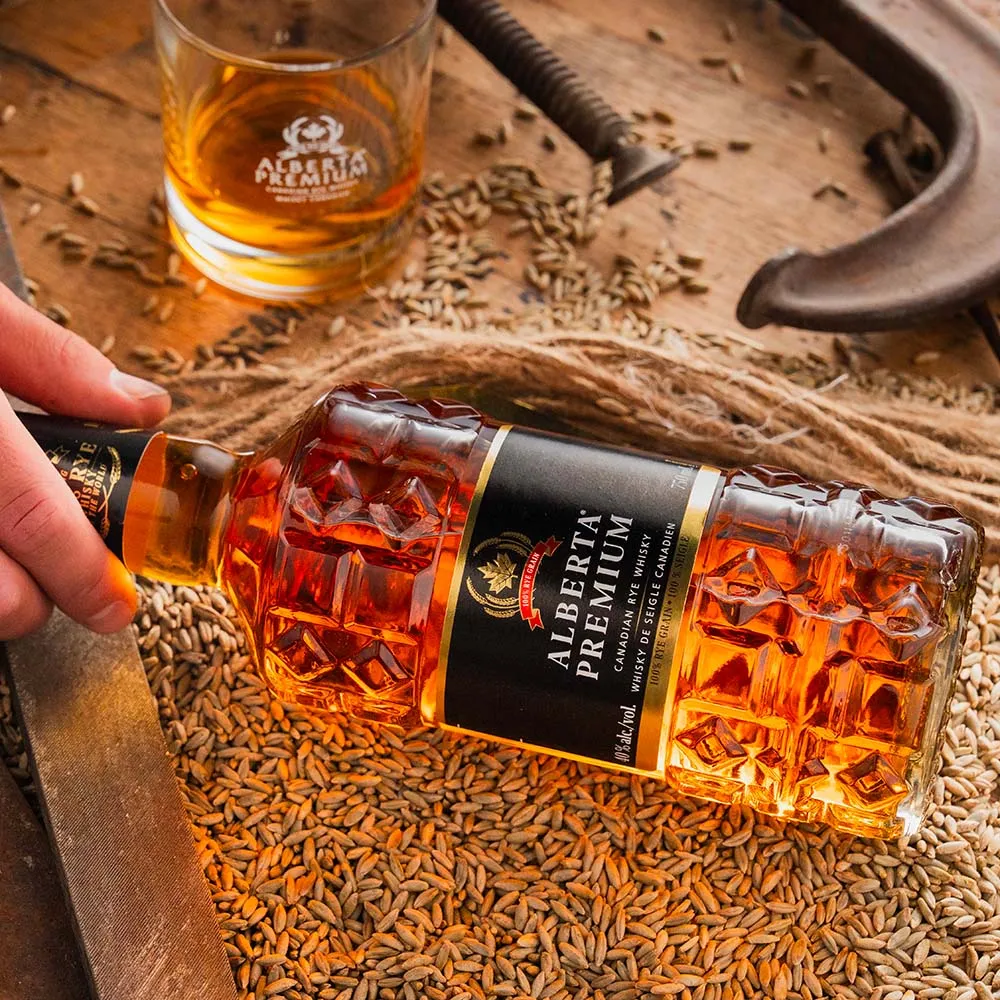 bottle-hand-wood-table-whisky-alberta