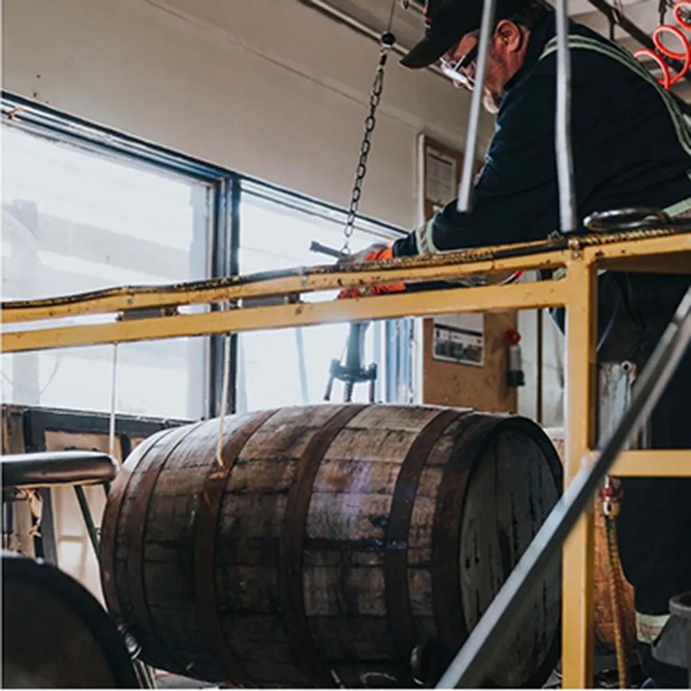 man-working-distillery-alberta
