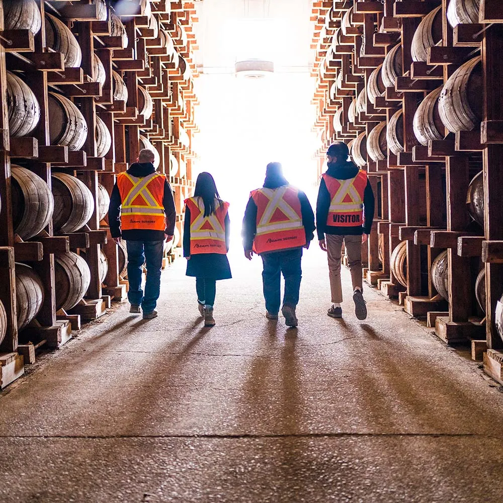 people-walking-distillery-barrells-alberta